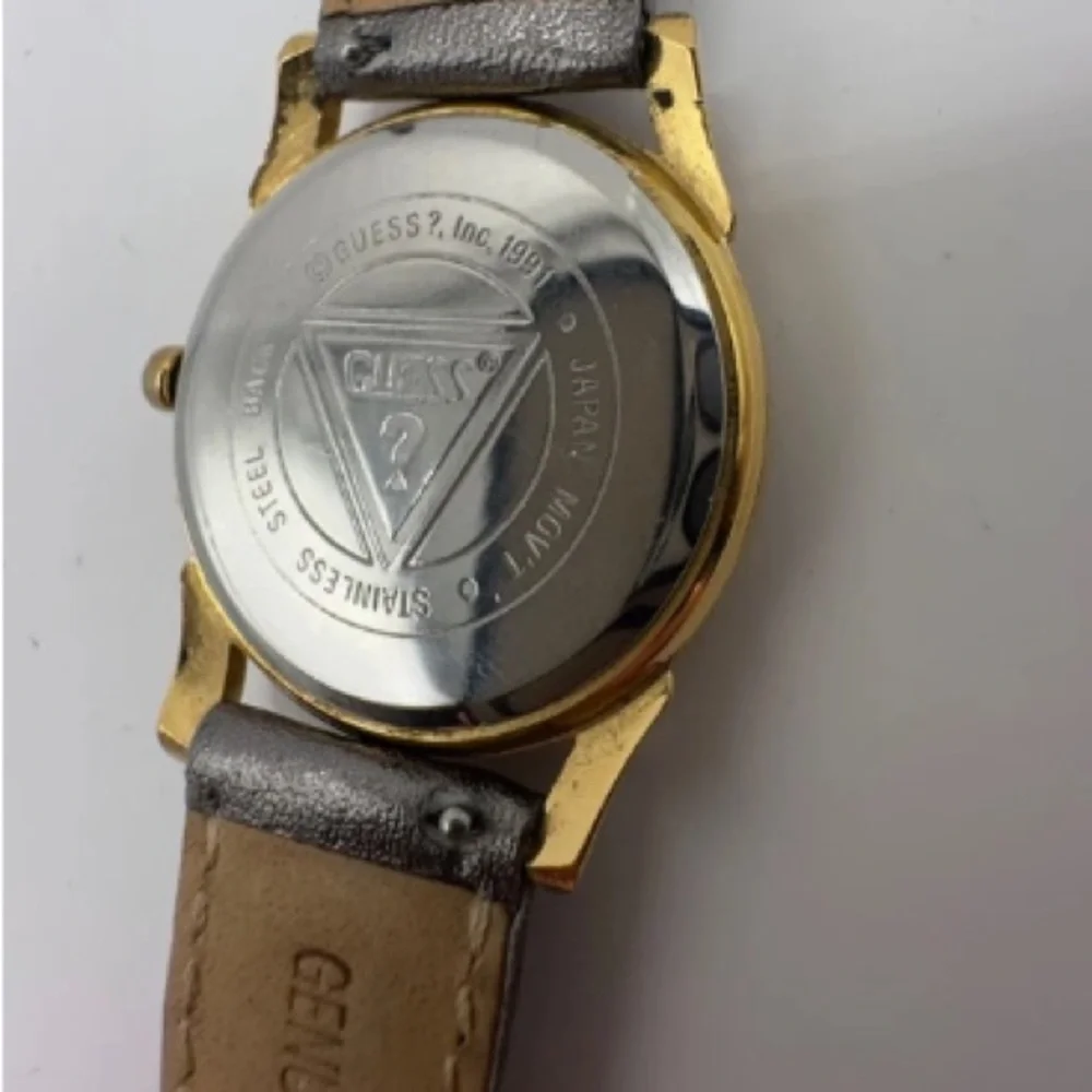 Guess Gold and Silver Quartz skeleton watch